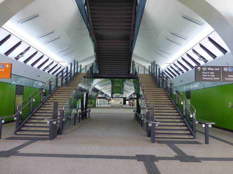 The concourse is at ground level and lit by natural light during the day. Access .to the rail platform is by two flights of stairs and up and down escalators and lift.