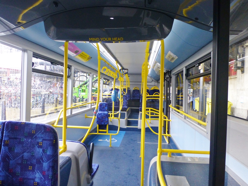 The floor is flat to the back of the centre door entrance and then requires passengers to go up steps to the seats at the back of the bus. The bus has 21 seats and room for 73 standees.